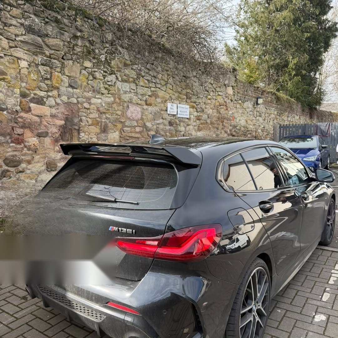 Black BMW M135i with glossy paintwork