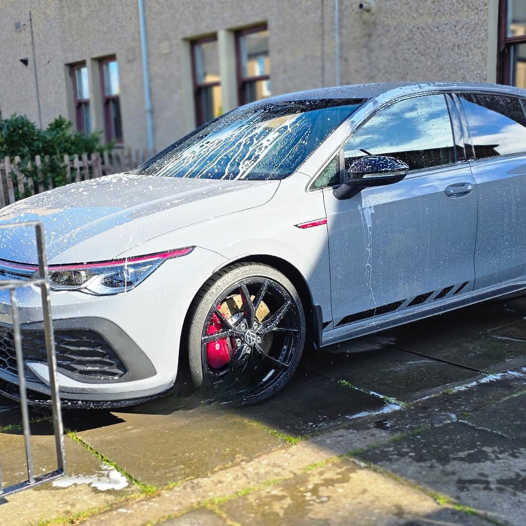 Volkswagen Golf R under snow foam