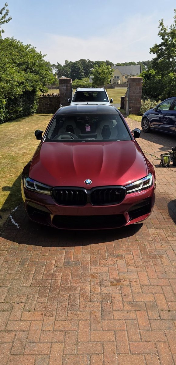 Red BMW M5 detailed to a deep gloss