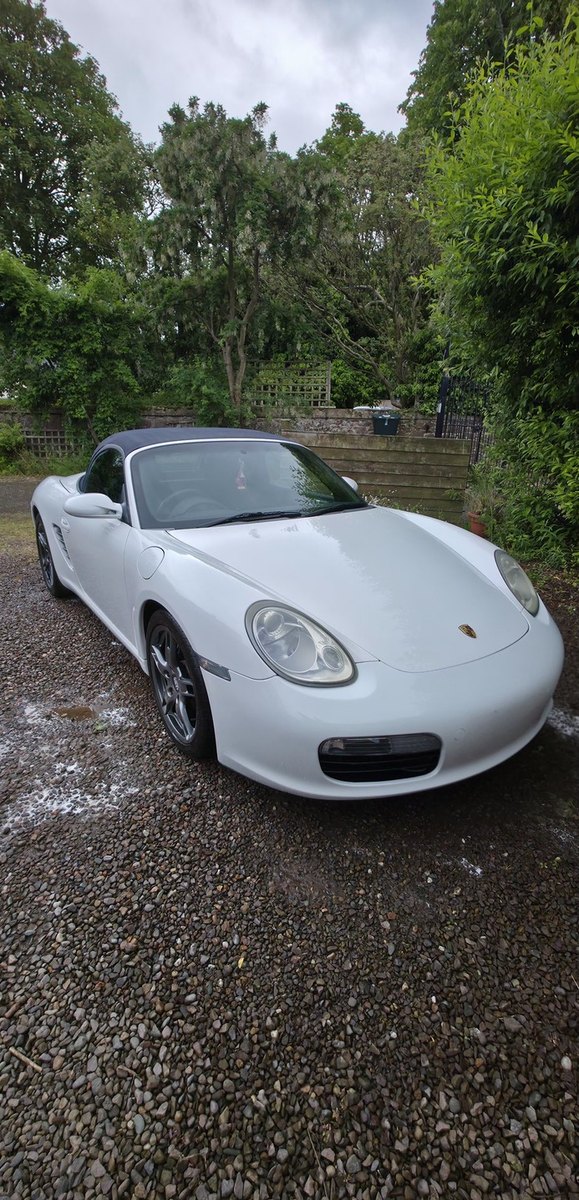 White Porsche Boxster detailed on the driveway