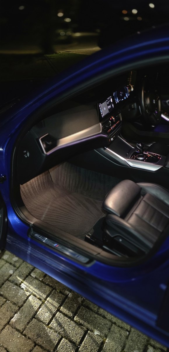 Car interior detailed and lit at night
